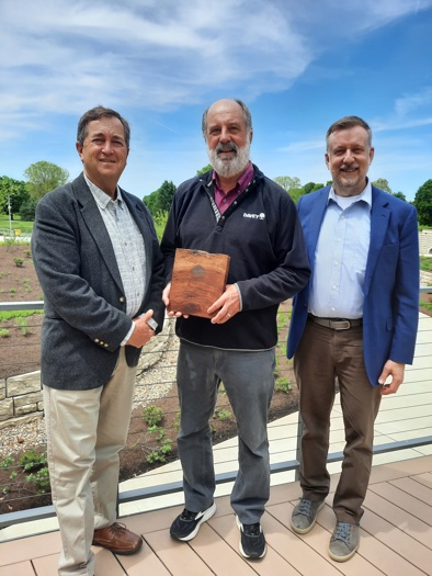 Dr. Dan Herms accepts the Ken Ottman Volunteer Award from TREEE Fund representatives
