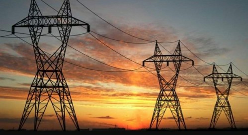 Utility lines and a sunset.