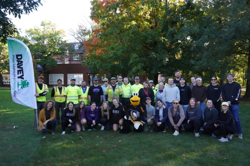 Volunteers from Davey Tree, the Pittsburgh Penguins and Tree Pittsburgh posing for a group photo with the Penguins mascot.