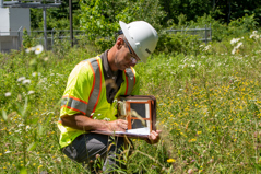 An arborists surveying a wetland