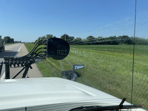 The evaluation of a sprayhead located on a truck driving down the road