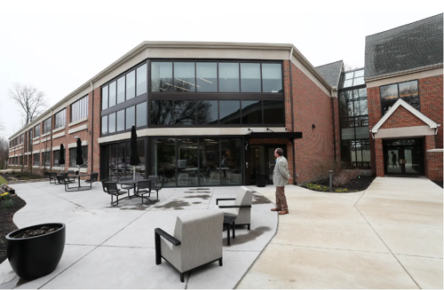 Brad Ehrhart, President Portage Development Board, admires the exterior of the newest addition to The Davey Tree Expert Company's recently renovated headquarters and the expanded facility during an Open House and tour of the facility in Kent on Friday, March 15, 2024.