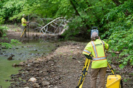 Davey Resource Group personnel working near a creek