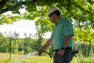 arborists watering a tree