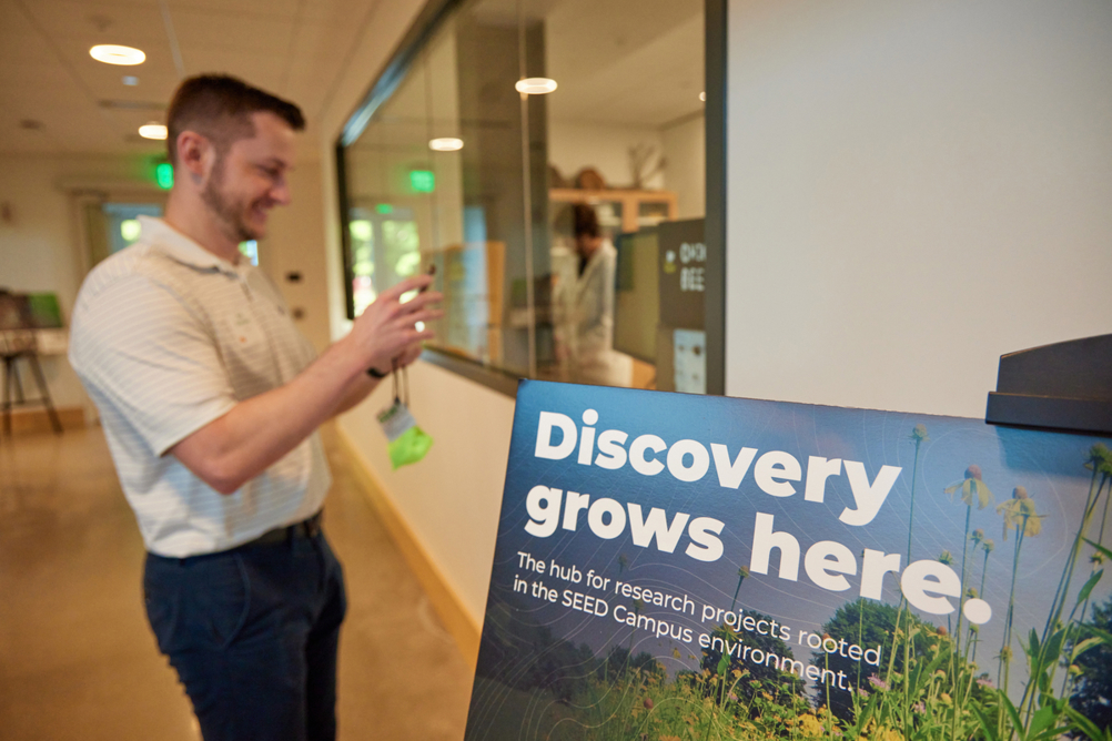 Davey employees take photos of spaces at new SEED Campus
