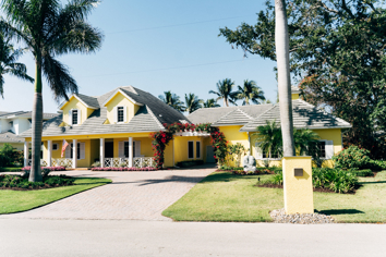 A street view of a home and its driveway