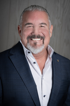 A professional headshot of a business man.