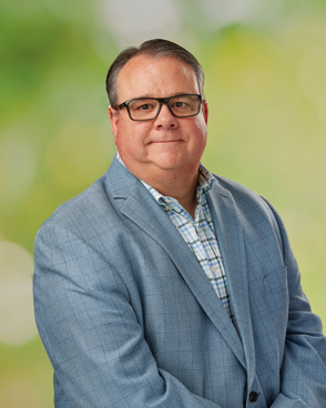 A professional headshot of a business man.